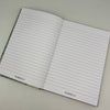 Open notebook with lined pages on a light gray background