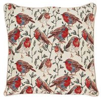 Decorative pillow with red robin bird pattern on a beige background