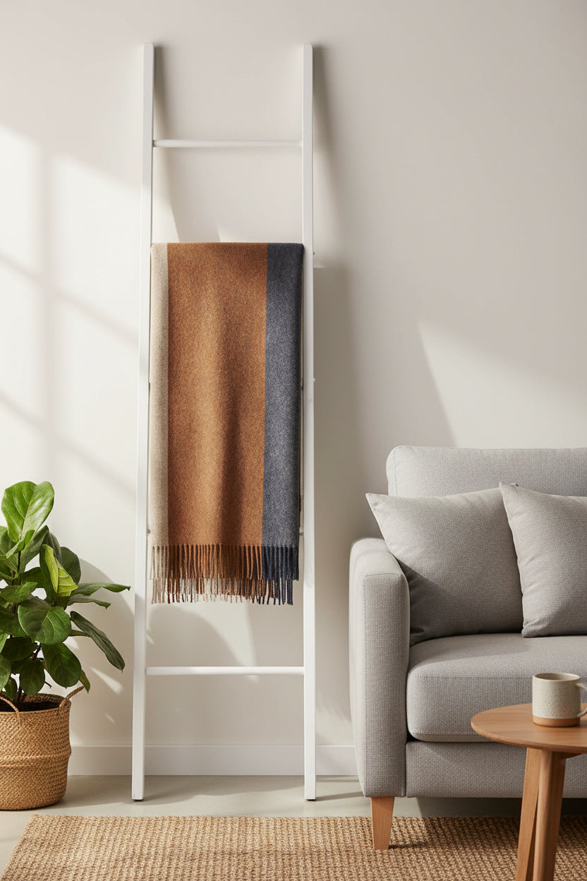 Color-blocked throw with brown, beige, and navy sections on a white background