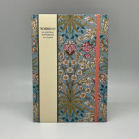 Floral notebook with a visible brand on a gray background