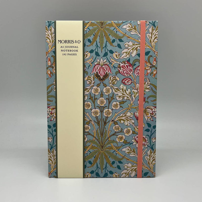 Floral notebook with a visible brand on a gray background