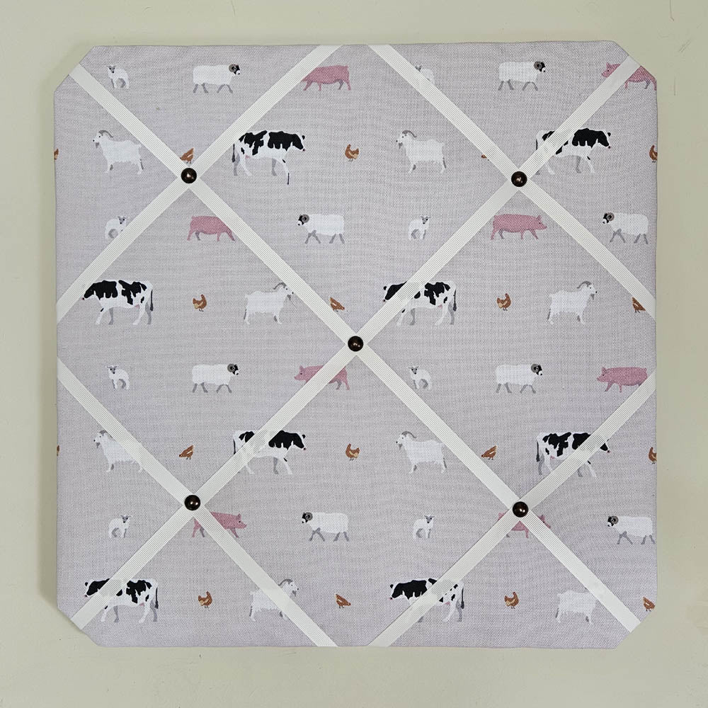 Memo board with farm animal pattern on a light gray background