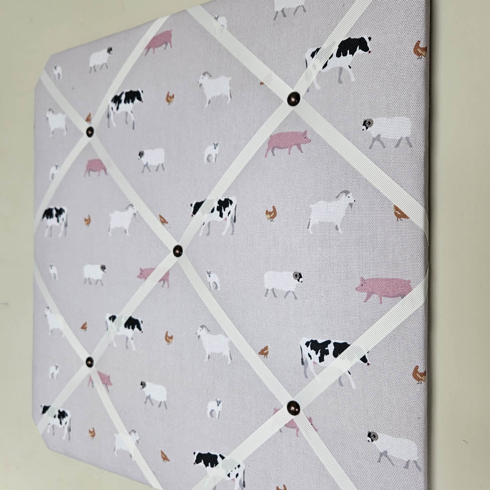 Memo board with farm animal pattern on a light gray background