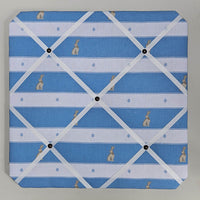 Memo board with blue and white striped pattern and small rabbit illustrations.