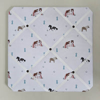 Memo board with horse-themed design on a light gray background