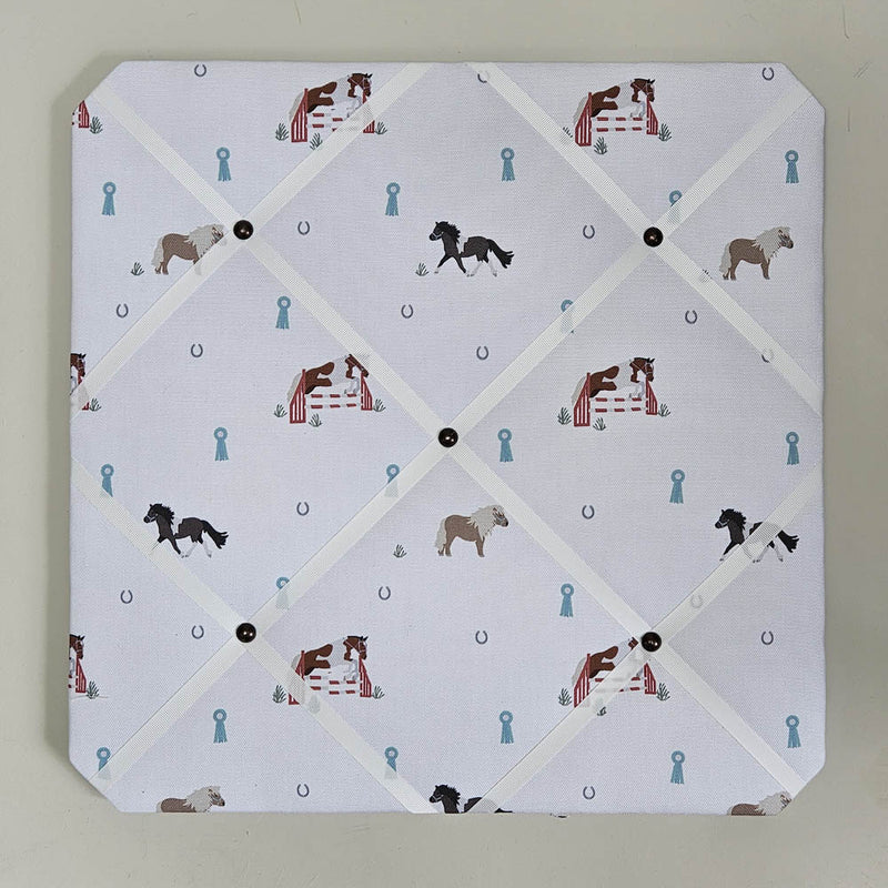 Memo board with horse-themed design on a light gray background