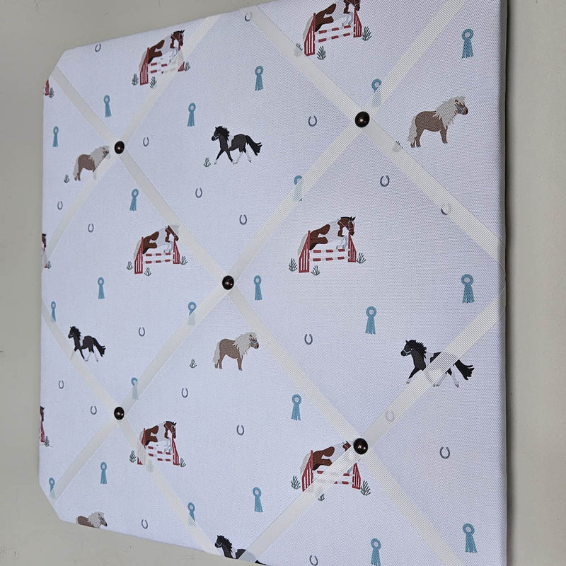 Memo board with horse pattern on a white background