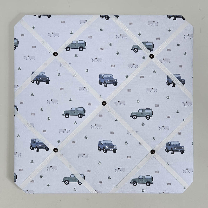 Memo board with vehicle pattern on a light gray background
