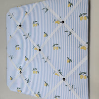 Memo board with lemon pattern on a light blue background