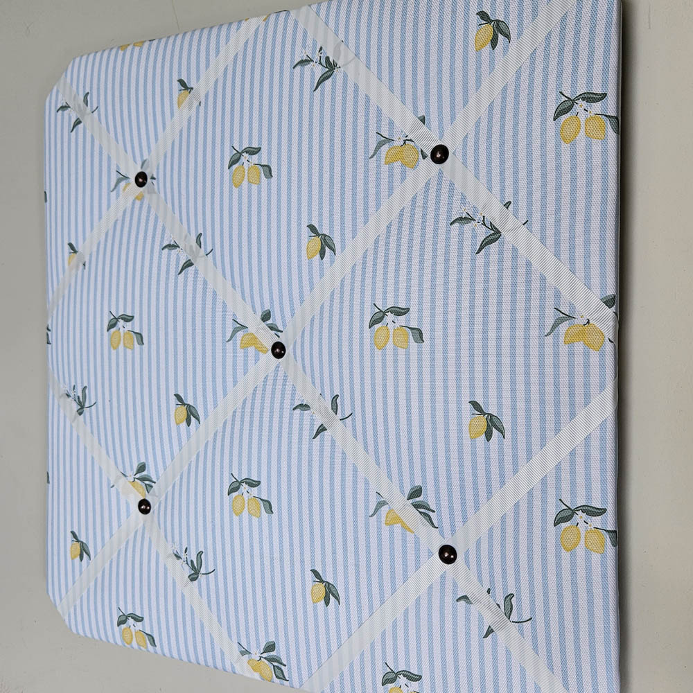 Memo board with lemon pattern on a light blue background
