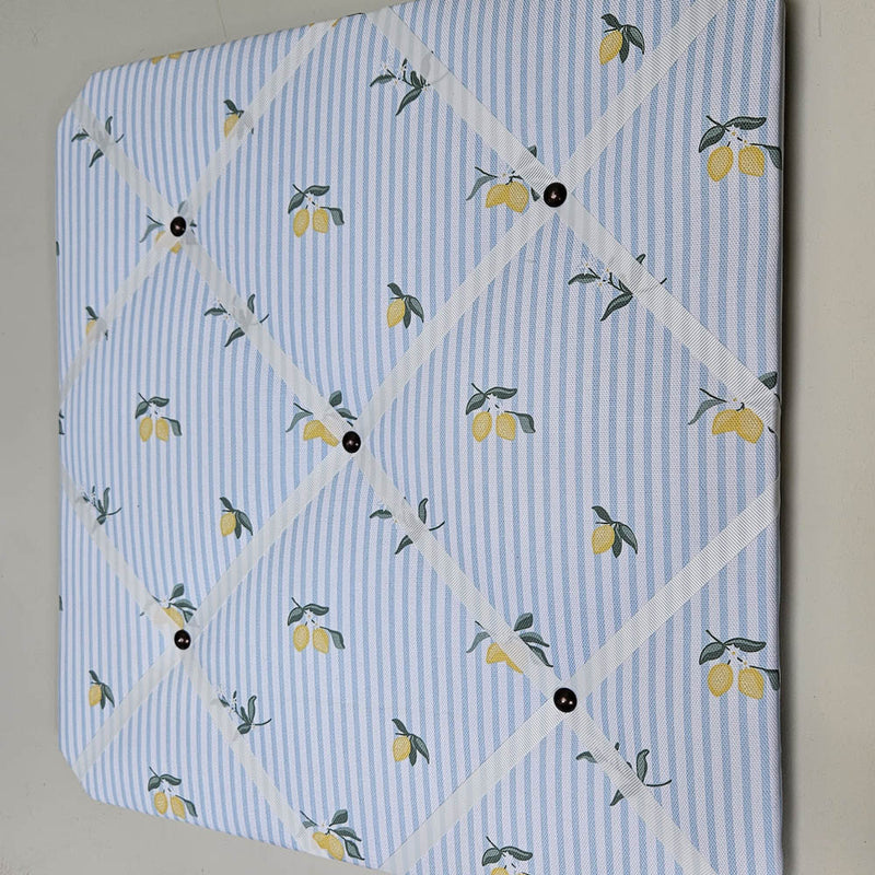 Memo board with lemon pattern on a light blue background
