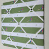 Fabric with a pattern of pheasants on a green and white checkered background