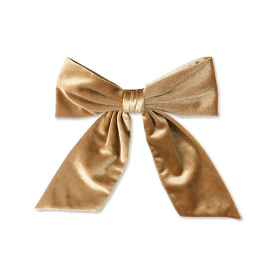 Gold velvet bow on a white background